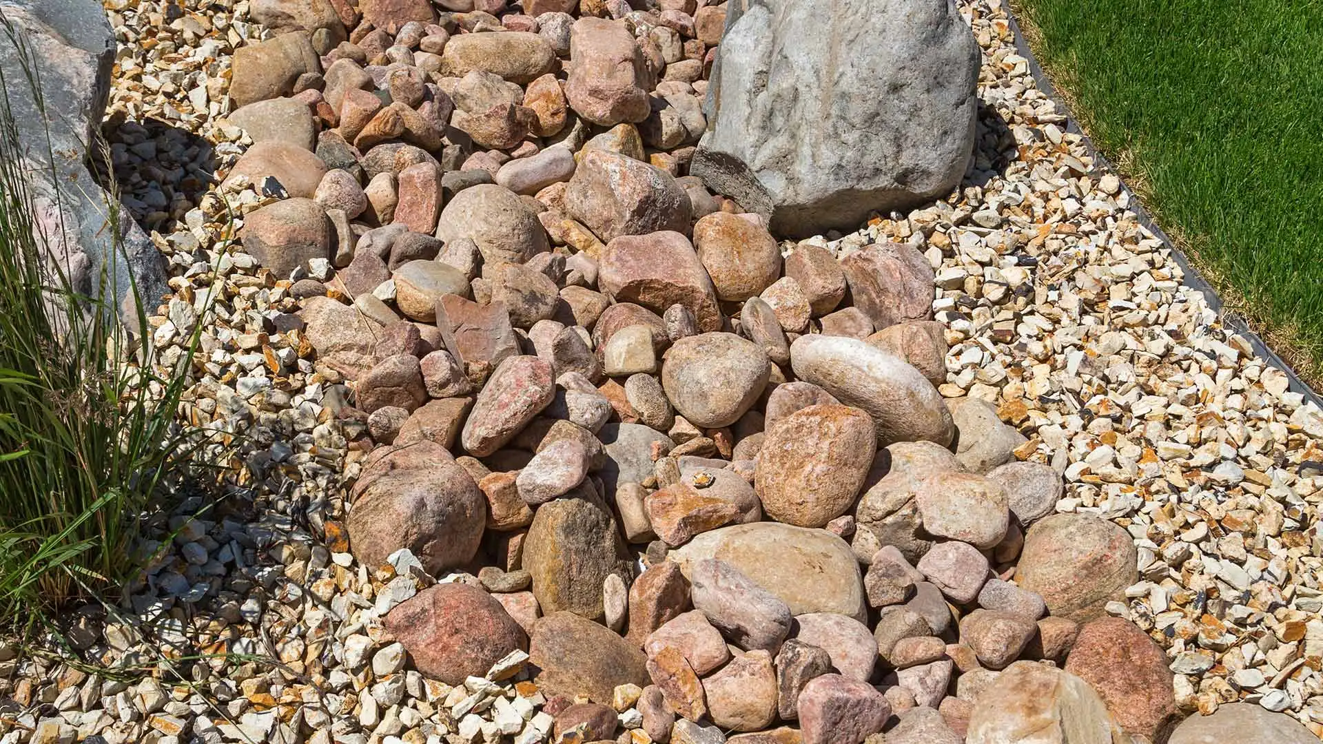 Drainage system covered in natural rock near Elkhorn, NE.