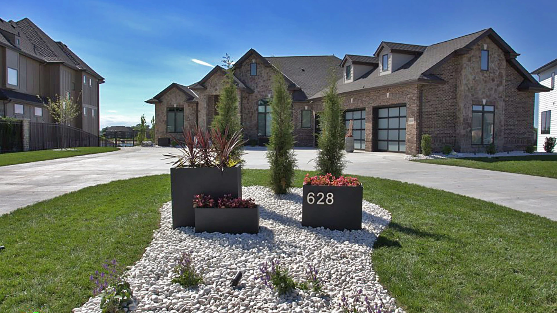 A custom landscape design in front of a home in Omaha, NE.