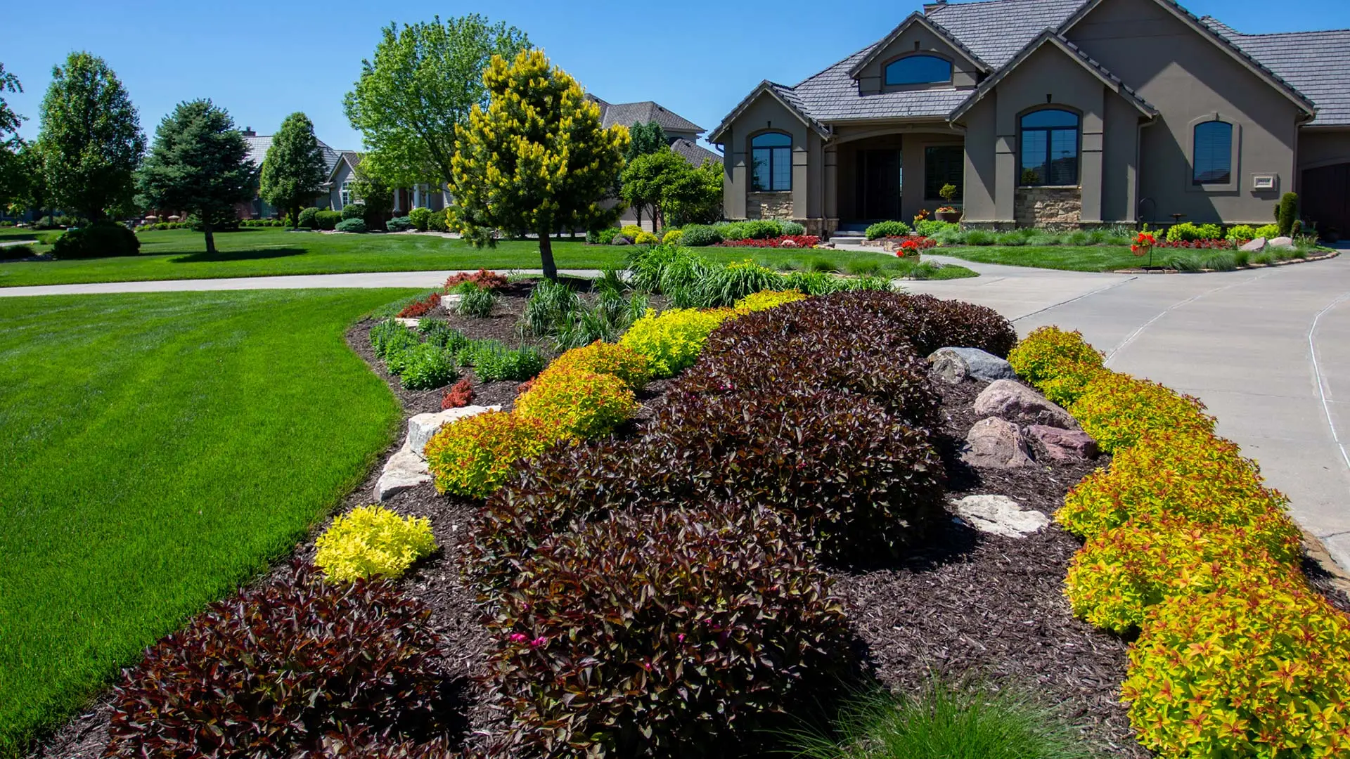 Visually stunning landscape bed built at a home in Waterloo, Nebraska.