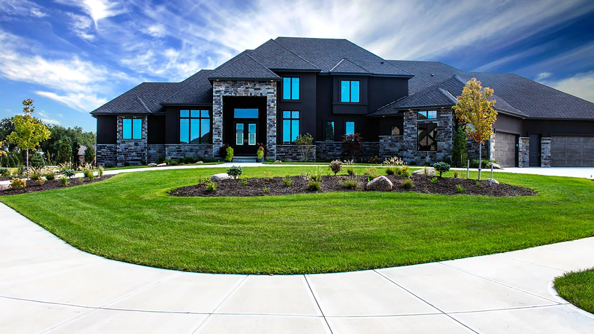 A home with a large healthy lawn in Bennington, NE.