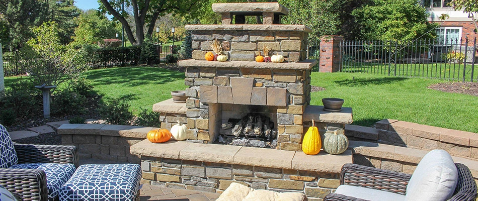 A newly installed fireplace surrounded by fall decorations in La Vista, NE.