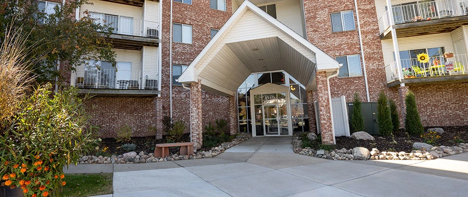 An apartment building with regular landscape maintenance in Omaha, NE.