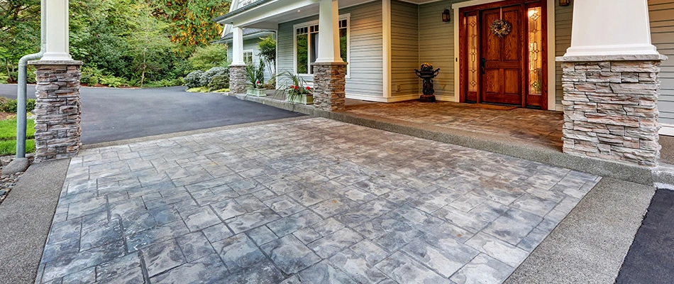 Custom driveway with an ashlar paver pattern in Papillion, NE.