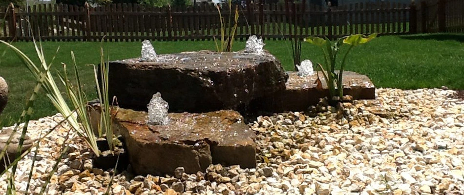 A set of 3 bubbling boulders build in a landscape in Valley, NE.