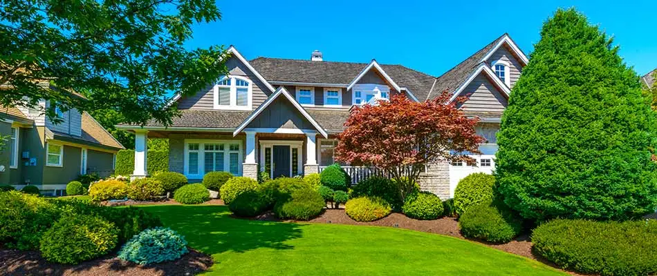 Omaha, NE home with regular landscape trimming and pruning.