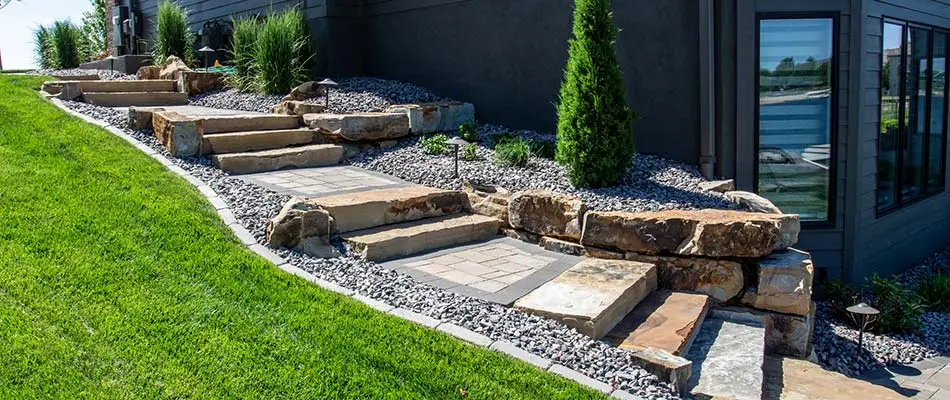 Well maintained landscaping along stone steps on a property in Elkhorn, NE.