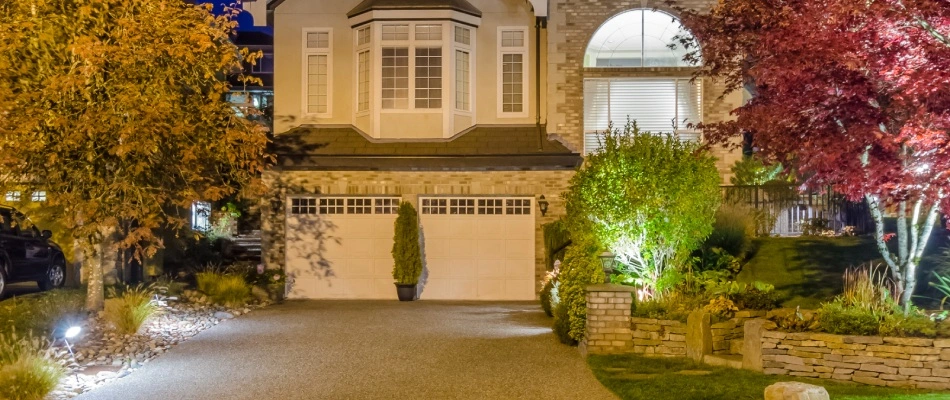 Moonlighting technique installed around trees and shrubs in Gretna, NE.