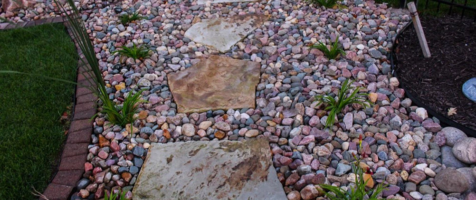 A bed topped with multicolored rocks in Elkhorn, NE.