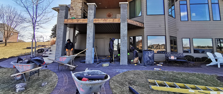 A patio under construction by a home in Gretna, NE.
