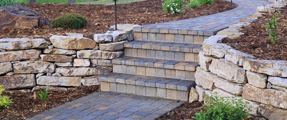 Retaining wall made of borders surrounding outdoor steps near La Vista, NE.