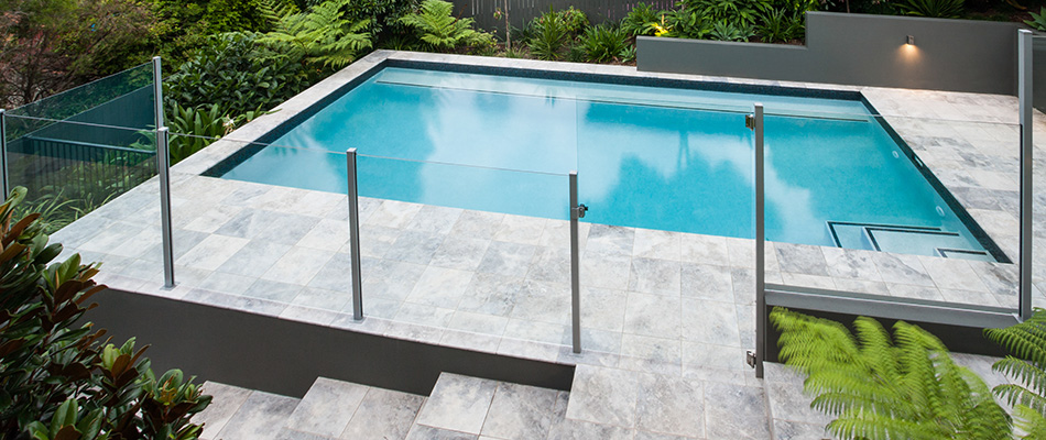 Pool deck with a stack bond paver pattern in Bennington, NE.