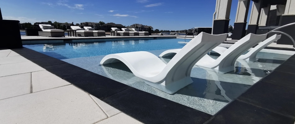 A sun shelf upgraded feature for a pool in La Vista, NE.