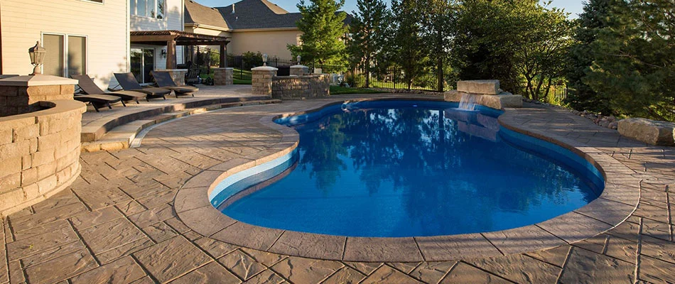 Custom swimming pool featuring a waterfall in Elkhorn, NE.