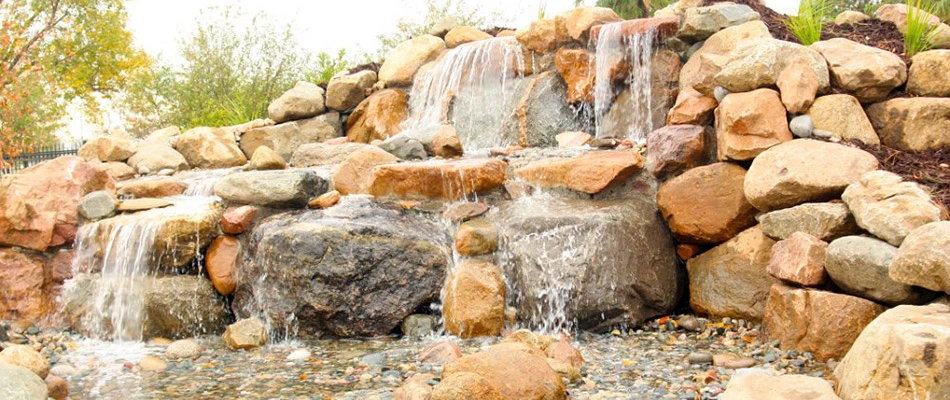 A grand waterfall built with a range of rocks in Bennington, NE.